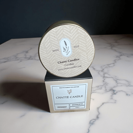 Chatté Peppermint candle in gold metallic tin with minimalist label, natural soy wax, by Mijn winkel on marble surface