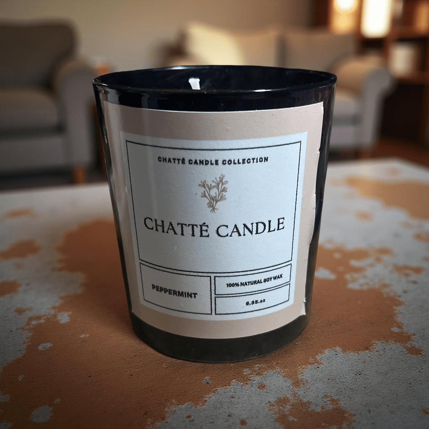Peppermint scented candle in black glass with minimalist label featuring 100% natural soy wax by Chatté Candles