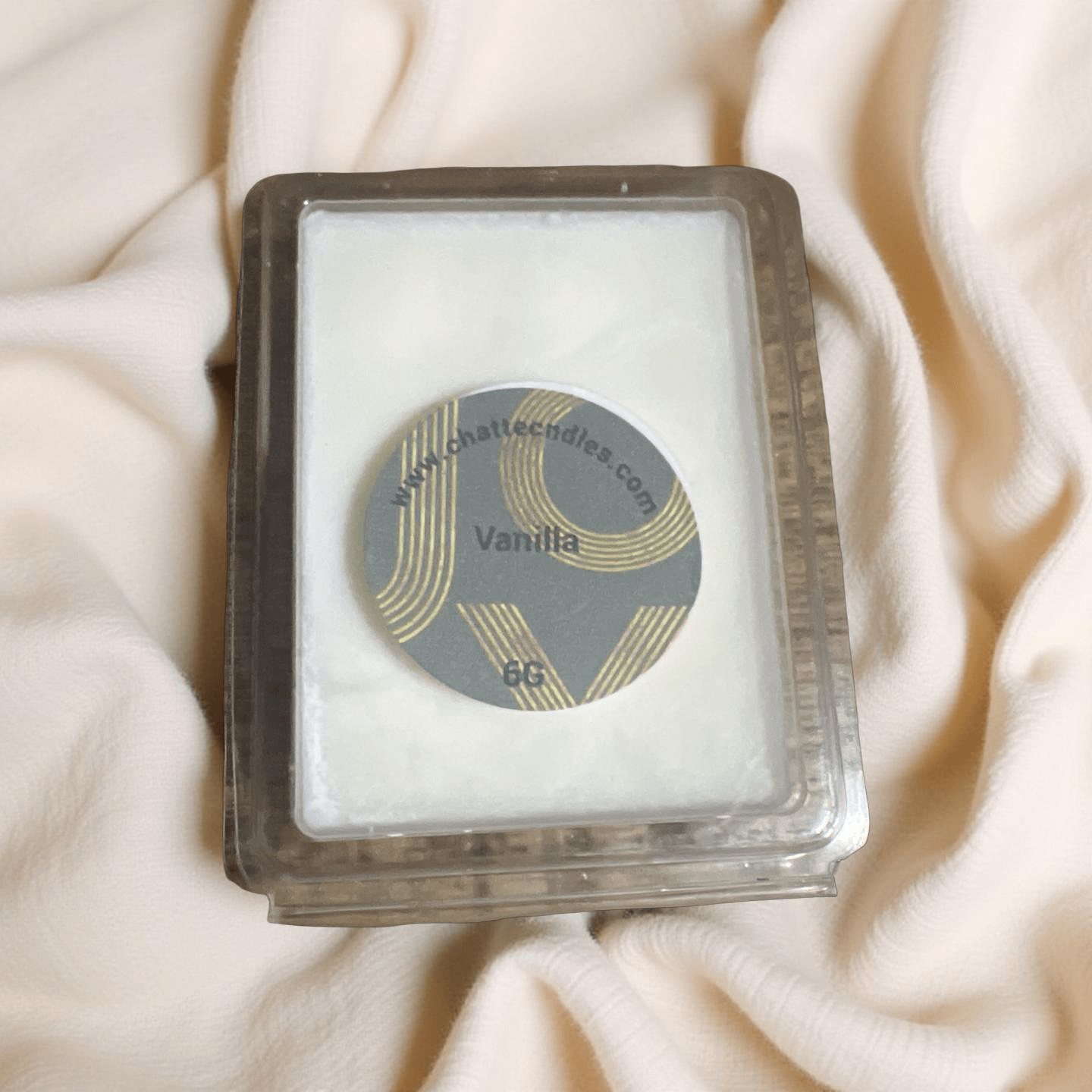 Vanilla scented wax melts in clear plastic clamshell with gold-accented label, warm creamy fragrance by Chatté Candles