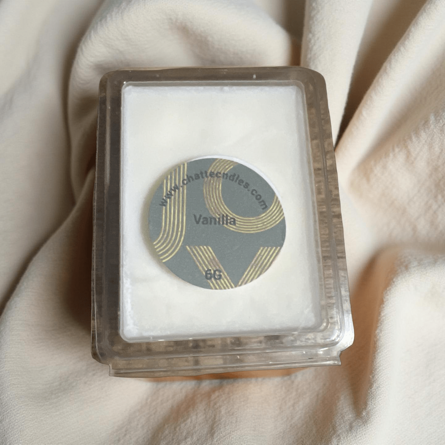 Vanilla scented wax melts in clear clamshell packaging with gold-accented label by Chatté Candles Ice Cream collection