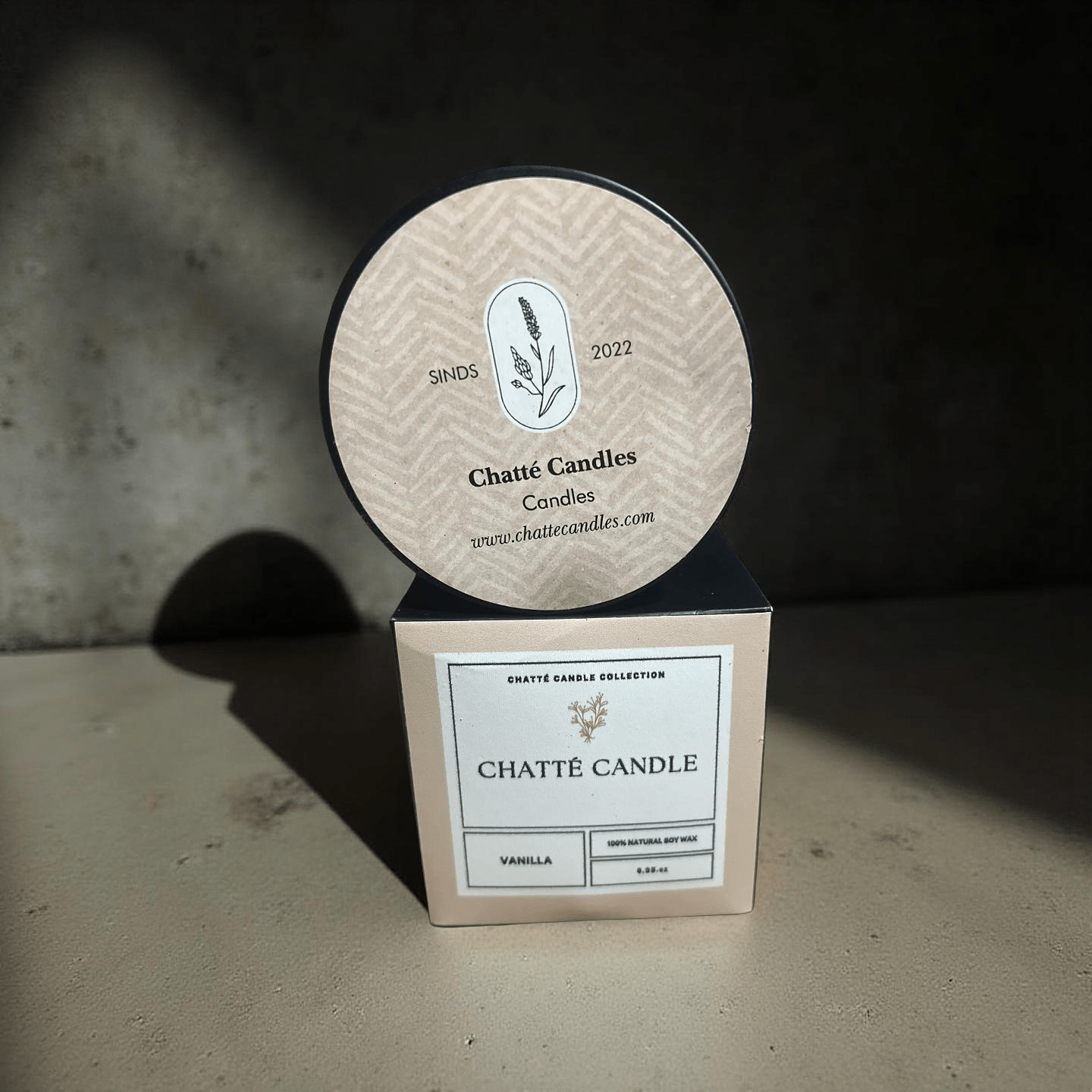 Vanilla scented candle in beige packaging with botanical logo, 100% natural soy wax by Chatté Candles since 2022