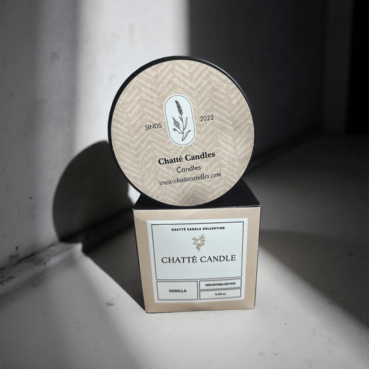 Vanilla Candle by Chatté Candles in beige packaging with botanical logo, photographed in natural light on neutral background